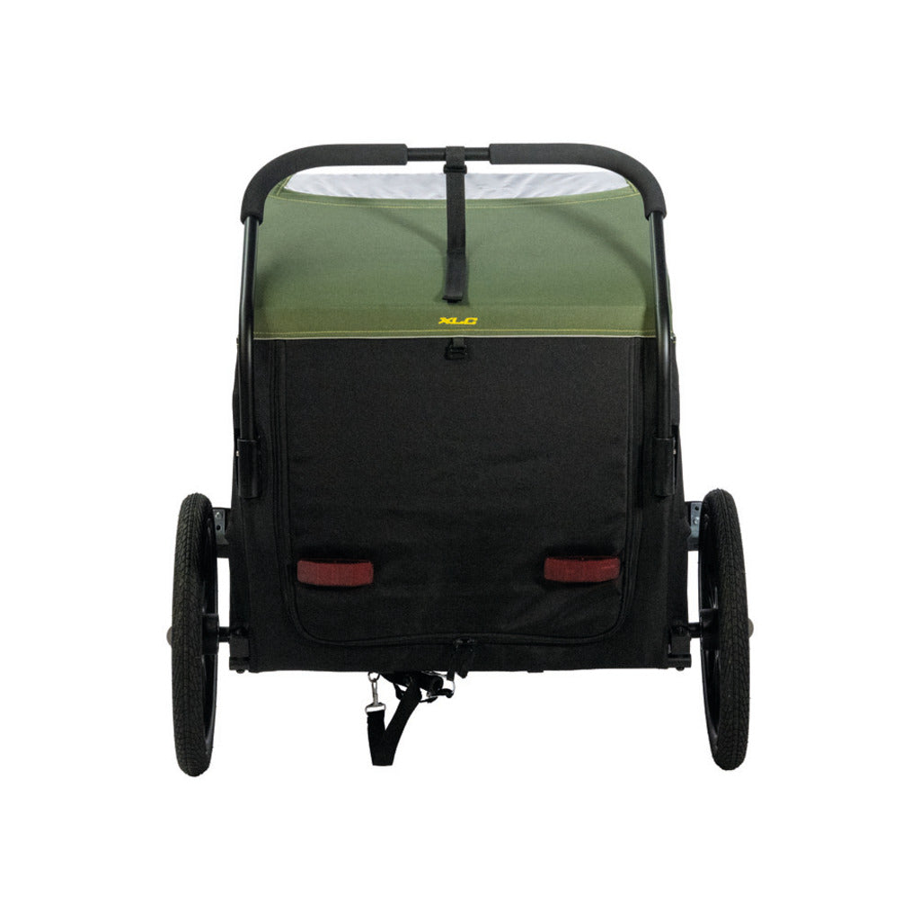 Zwarte en groene inklapbare XLC hondenfietskar voor kleine honden, 16-inch wielen, geschikt voor fietsen.