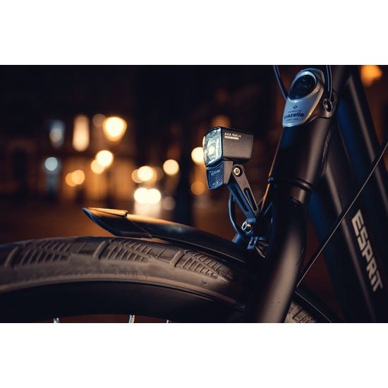 Axa NXT koplamp voor e-bike, 6-12V, met ingebouwde reflector en duidelijk zichtbare lamp en reflector in de afbeelding