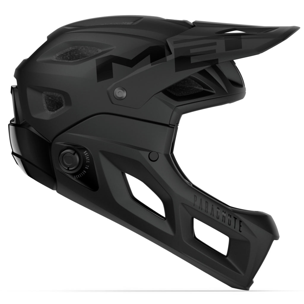 MET Parachute Mcr Mips fietshelm, volledige gezichtsbescherming, zwart met ventilatieopeningen, getoond op de afbeelding.