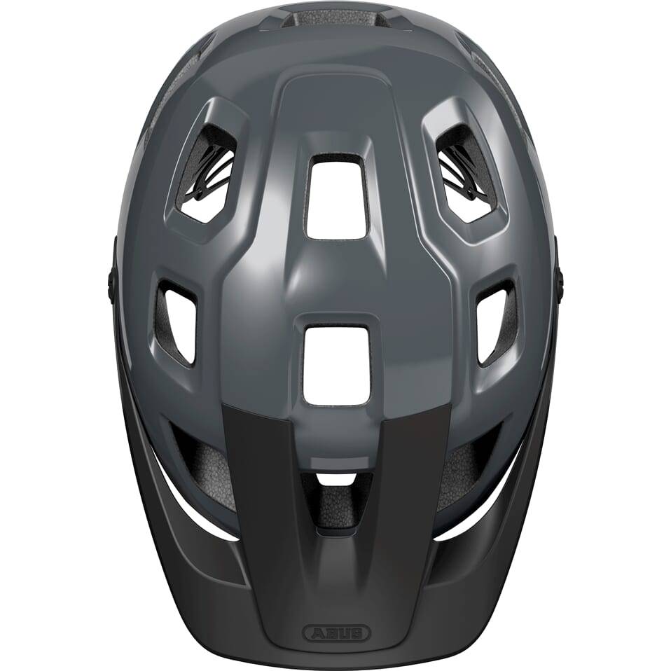 Abus Motrip MTB fietshelm in grijs met diepe pasvorm en ventilatiegaten, geschikt voor mountainbiken.