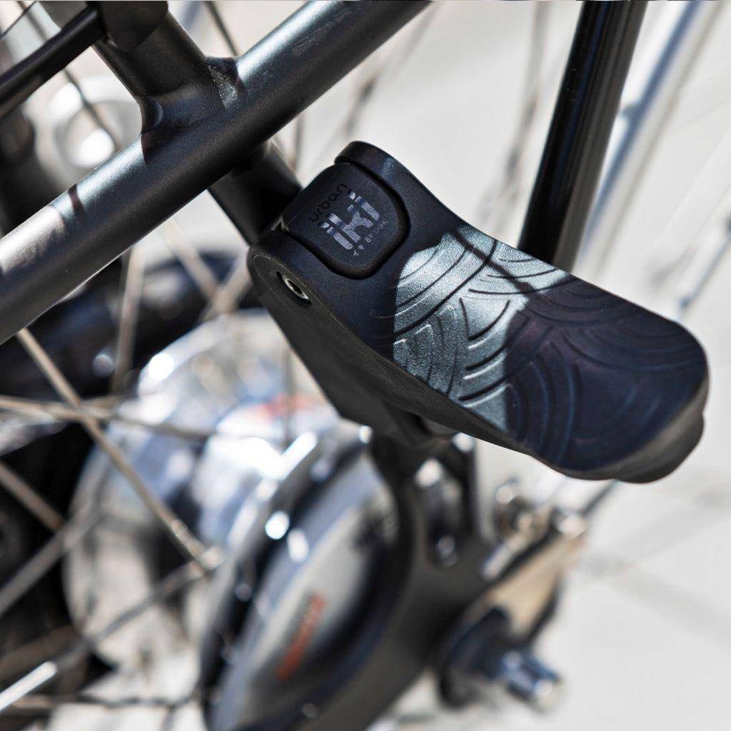 Urban Iki Junior fietsstoeltje achter zonder montagekader, zwart en bruin, geschikt voor kinderfietsen, comfortabel en veilig.