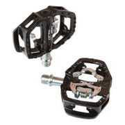 Zwarte XLC MTB pedaal ATB Combi PD-S14 met 9/16" SPD-compatibiliteit, zichtbaar op een fiets, geschikt voor off-road rijden