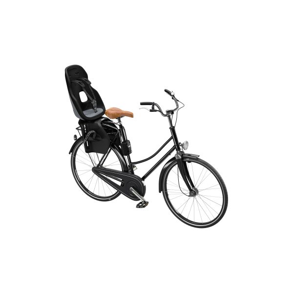 Thule Yepp Nexxt 2 Maxi achter kinderfietsstoeltje voor framebevestiging, geel en zwart, zichtbaar op de fiets bevestigd