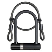 Zwarte Axa Newton Mini U-slot beugelslot met kabel voor extra beveiliging, zichtbaar in de afbeelding.