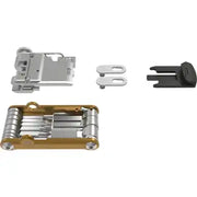 Zwart Topeak Minitool Mini PT30 multitool met diverse gereedschappen voor fietsreparaties, gelegen op een werkbank