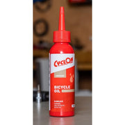 Fietsolie van CyclOn, waterafstotende smeermiddel voor fietsen, 100 ml fles met doseerspuit, geschikt voor onderhoud van fietskettingen