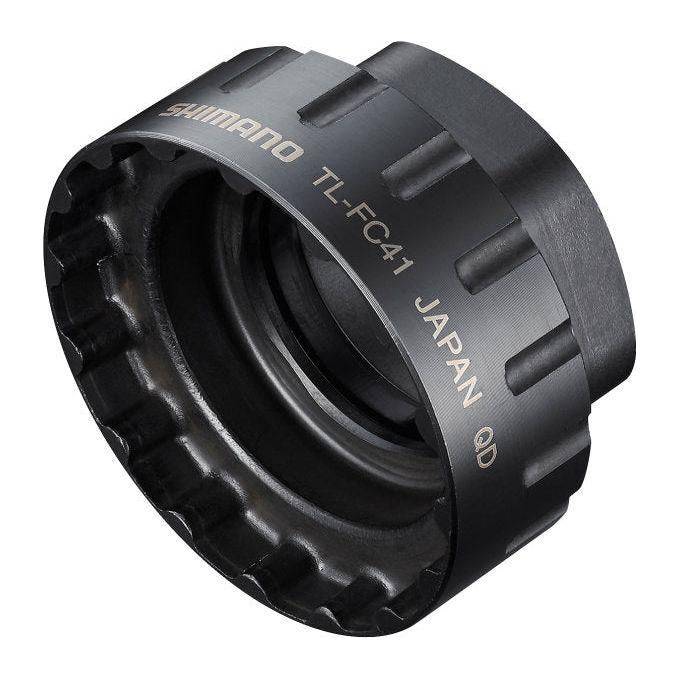 Shimano TL-FC41 crankstelgereedschap voor kettingbladen, gemaakt van gehard staal, ligt op een werkbank.