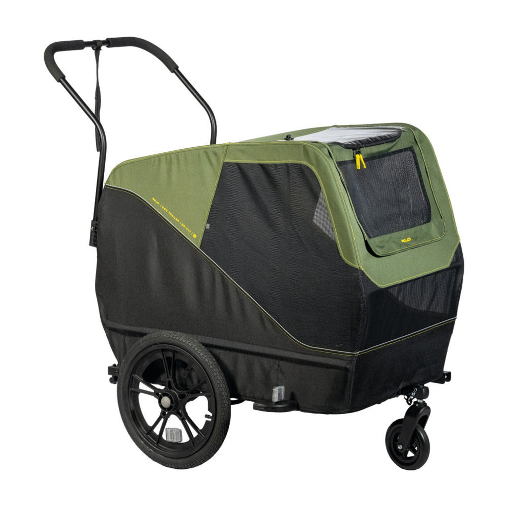 Zwarte en groene XLC hondenfietskar L BS-C13 met ramen en ventilatie voor huisdieren, geschikt voor fietsen.