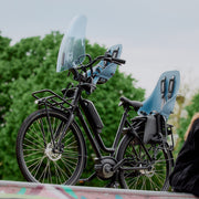 Urban Iki achterzitje Bincho stylingset voor fietsstoeltjes, met kleurrijke accessoires en bevestigingsmateriaal.