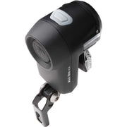Zwarte Axa Nox City 4 Lux fiets koplamp met batterij, zichtbaar van voren op een witte achtergrond