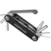 Topeak Ninja Master+ gereedschapskist T11 met blauwe deksel en diverse gereedschappen voor fietsreparaties, zichtbaar in de afbeelding.