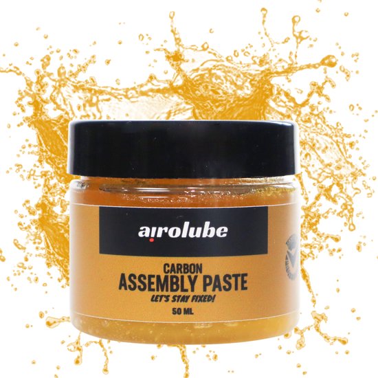 Airolube montagepasta Carbon Assembly Paste, biologisch afbreekbaar, in een open blik met pasta zichtbaar.