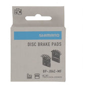 Shimano J04C metalen schijfremblokset met koelvinnen voor fietsremmen, zichtbaar met remblokken en koelvinnen in beeld