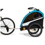 Burley D'lite X enkele kinderfietskar in sage groen en charcoal grijs, met stevige constructie en veiligheidsriemen.