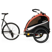 Burley Cub X kinderfietskar voor 2 personen met verstelbare vering in Sandstone Red en Charcoal Grey, zichtbaar in de afbeelding