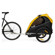 Zwarte en gele Burley kinderfietskar Rental Cub, inklapbaar voor 2 kinderen, geschikt voor fietstochten en vervoer.