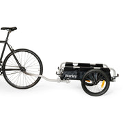 Zwarte Burley Flatbed transportkar voor fietsen, inklapbaar en geschikt voor het vervoeren van lading en bagage.