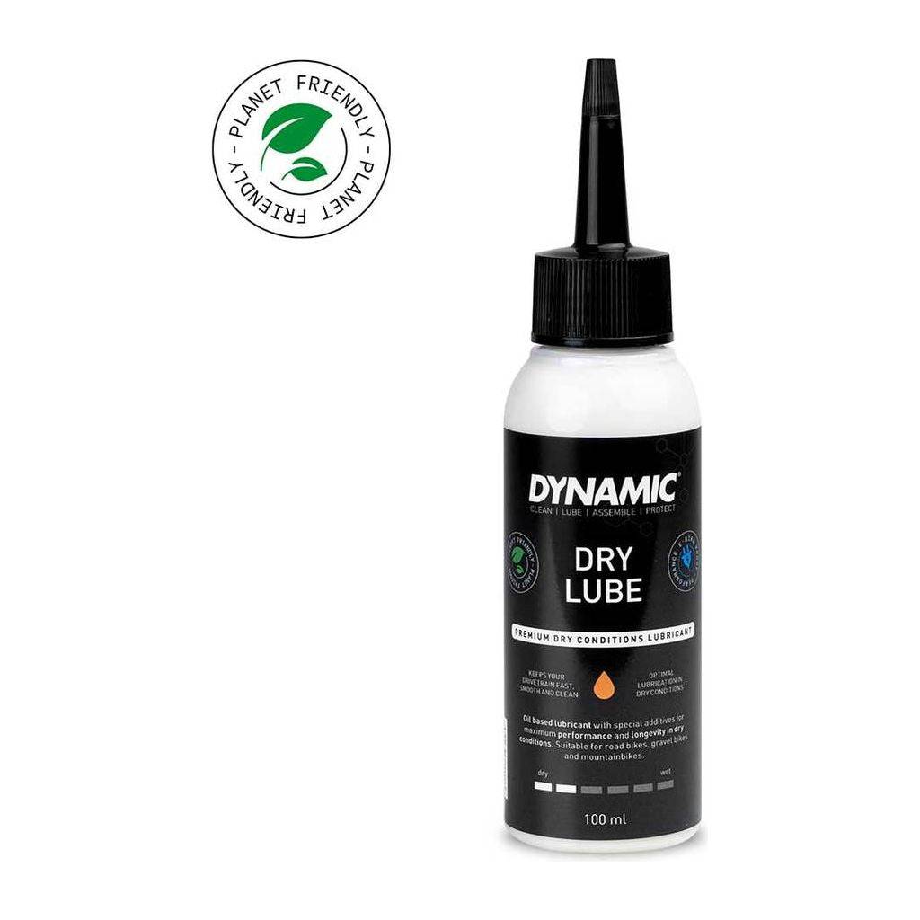 Dynamiс Dry Lube olie 100 ml, smeermiddel voor fietsen en machines, in een open fles met dop, zichtbaar in de afbeelding.
