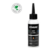 Dynamiс Dry Lube olie 100 ml, smeermiddel voor fietsen en machines, in een open fles met dop, zichtbaar in de afbeelding.