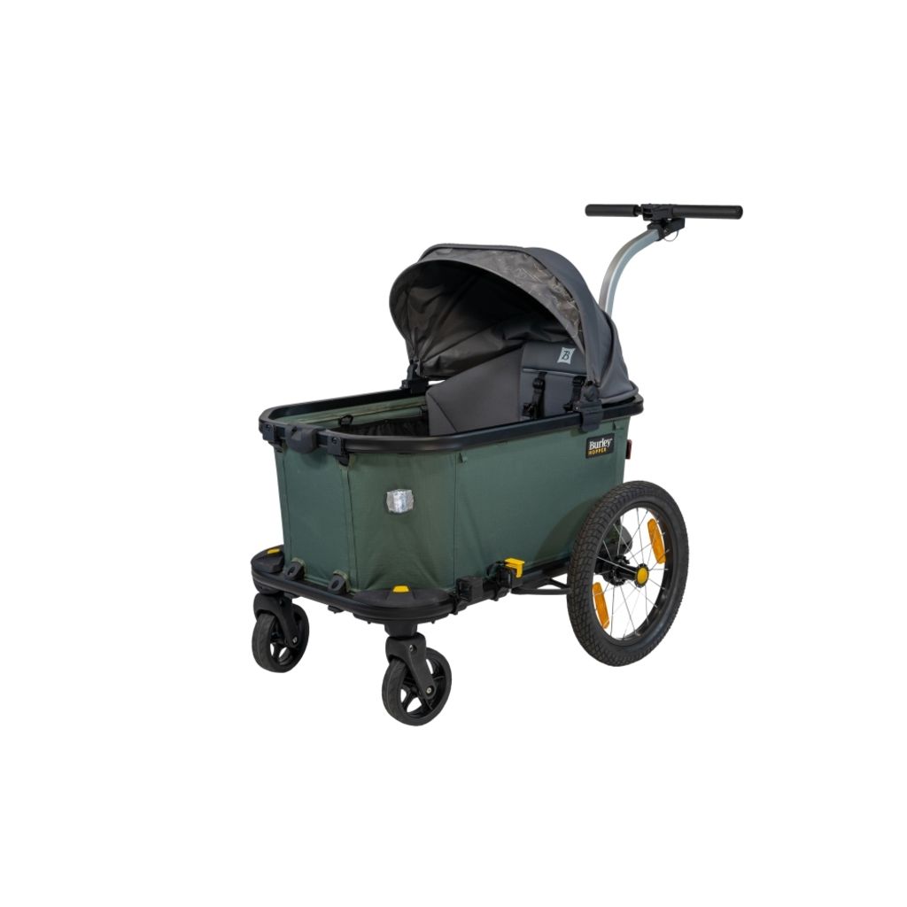 Groene en zwarte Burley Hopper Cargo fietskar met 45 kg laadvermogen, geschikt voor transport en boodschappen.