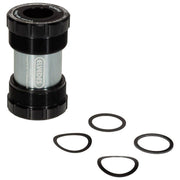 Zwarte Elvedes Trapas Cupset Threatfit T47 Shimano 68mm, zichtbaar met trapas en crankset voor fiets.