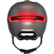 Abus Hud-Y urban e-bike helm met magnetisch USB-achterlicht, lichtgewicht en veilig voor dagelijks gebruik op de fiets.