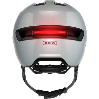 Abus E-Bike helm Hud-Y met ventilatieopeningen en verstelbare riem, ontworpen voor veilig fietsen op elektrische fietsen.