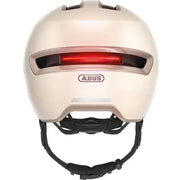 Abus Hud-Y urban e-bike helm met oplaadbare magnetische achter-LED en ventilatiegaten, geschikt voor comfortabel stadsfietsen.