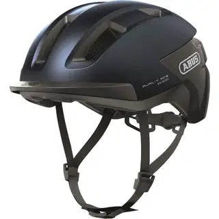 Abus Purl-Y Ace speed pedelec fietshelm met aerodynamisch ontwerp en ventilatiegaten, zwart met rode details, op de fiets geplaatst.