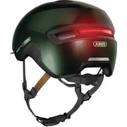 Abus Hud-Y Urban E-bike helm met magnetische USB-LED verlichting, wit met zwarte details en verstelbare riem.