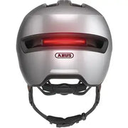 Abus Hud-Y Urban e-bike helm met magnetische USB-LED-verlichting, zwart met reflecterende details, voor veilig fietsen.