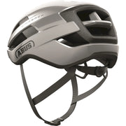 Abus Wingback racefietshelm met aerodynamisch ontwerp en ventilatiegaten, geschikt voor wielrenners, in zwart en rood.