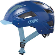 Abus Hyban 2.0 E-bike helm met geïntegreerd LED-achterlicht, blauwe kleur en ventilatieopeningen voor veilig fietsen.