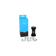 Zwarte Elvedes Trapas Cupset Threatfit T47 Praxis 86mm, zichtbaar met trapas en kettingblad in de afbeelding