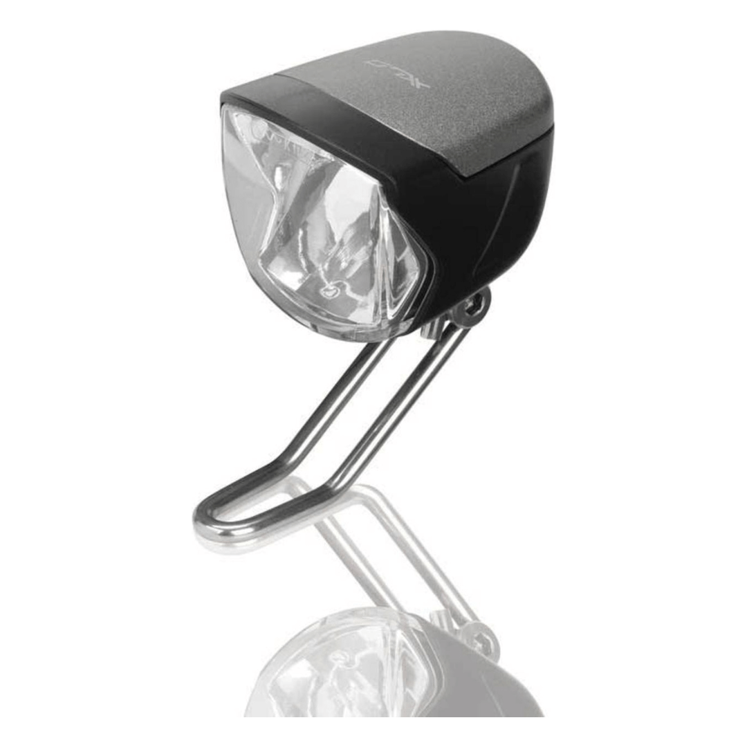 Zwarte XLC koplamp met LED, standlicht sensor en 6-48V voor fietsverlichting, zichtbaar met verstelbare mount en sensorelement.