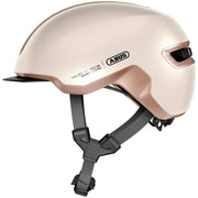 Geel Abus Hud-Y e-bike helm met oplaadbare magnetische achter-LED en ventilatie voor veilig fietsen.