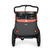 Burley Cub X kinderfietskar met verstelbare vering in Sandstone Red en Charcoal Grey, geschikt voor 2 kinderen.