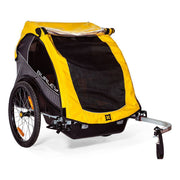Burley Rental Cub kinderfietskar voor 2 kinderen, inklapbaar, zwart en geel, ideaal voor veilig en comfortabel fietsen.