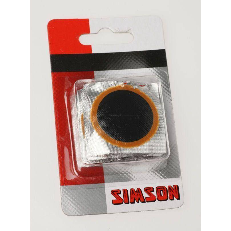 Simson binnenbandpleisters reparatieset voor fietsbanden, inclusief verschillende reparatiedoppen en lijm, in compacte verpakking.