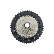 Shimano SLX CS-M7000 11-speed cassette met HG-spiderconstructie, zichtbaar met tandwielen en mechanisch ontwerp.